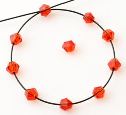 steklene perle - bikoni, 3x2,5 mm, orange red, 1 kos