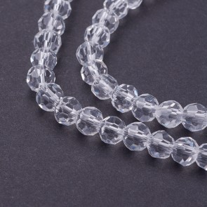 Steklene perle, nepravilno okrogle 4 mm, velikost luknje 1 mm, prozorne b., 1 niz - cca 92 kos
